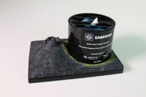 Custom deal toy combining acrylic cylinder and stone base to represent salmon sector