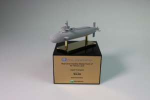 Submarine-themed deal toy mounted on acrylic base, marking specialist investment fund milestone.