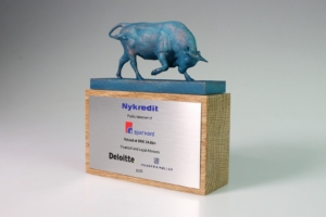 Bull sculpture financial tombstone celebrating Nykredit public takeover of Spar Nord, valued at DKK 24.8bn.