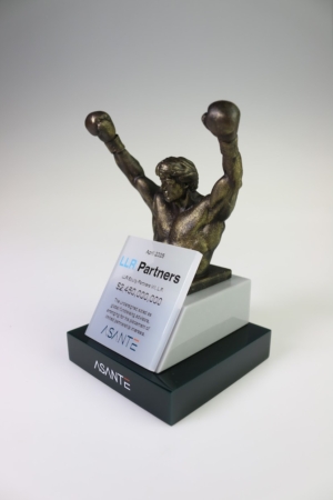 Bronze-finish boxing sculpture deal toy celebrating private equity investment success.