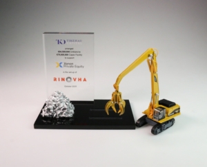 Bespoke financial tombstone with industrial crane model and acrylic plaque for private equity transaction.